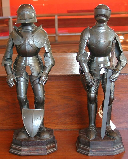 A pair of patinated tin-plate figures of knights in armour