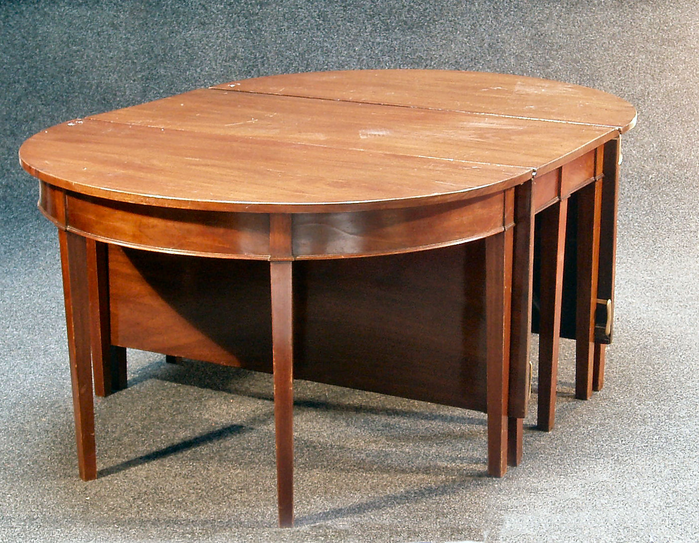 A George III mahogany dining table,