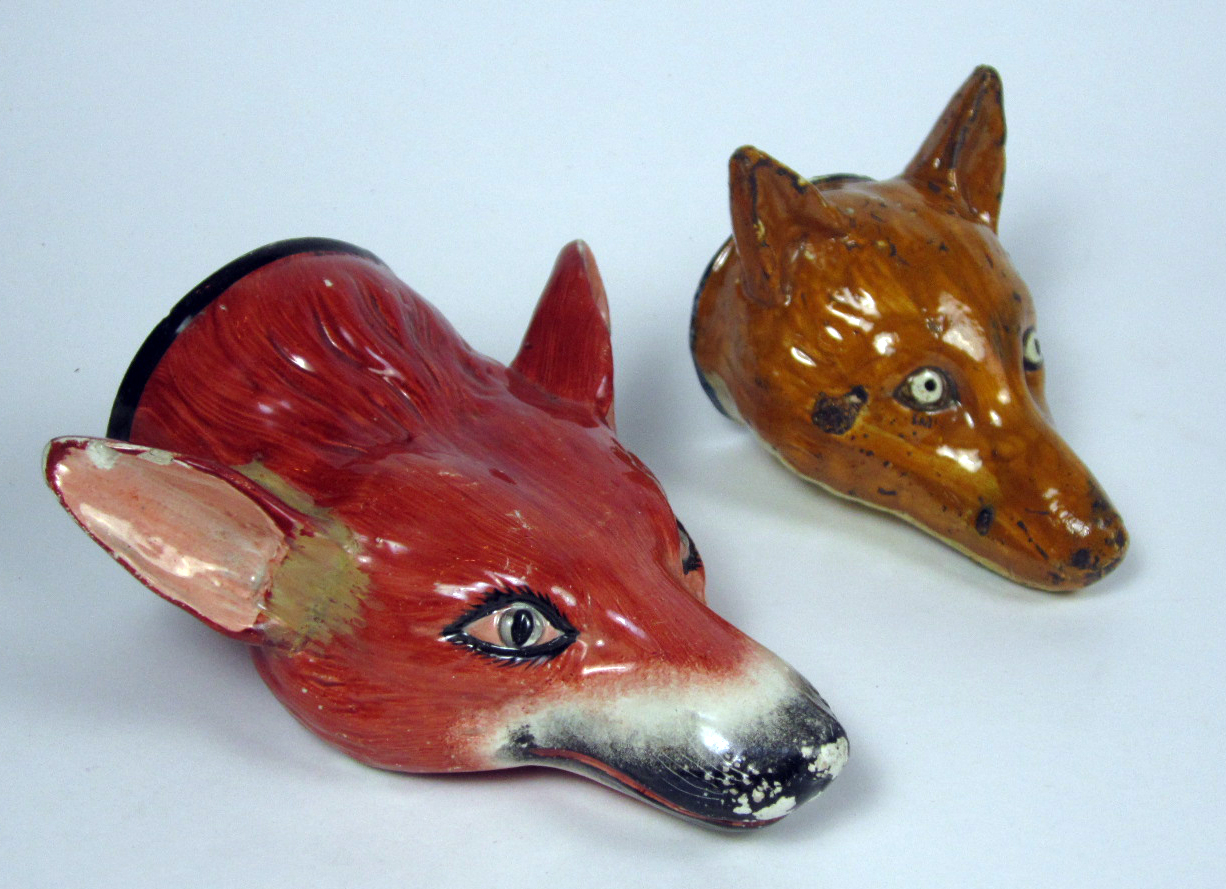FOUR STAFFORDSHIRE POTTERY FOX HEAD STIRRUP CUPS