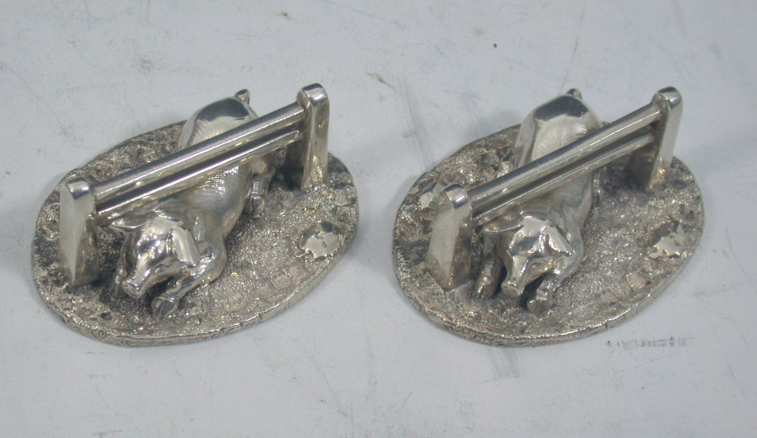 A pair of Edwardian novelty knife rests,