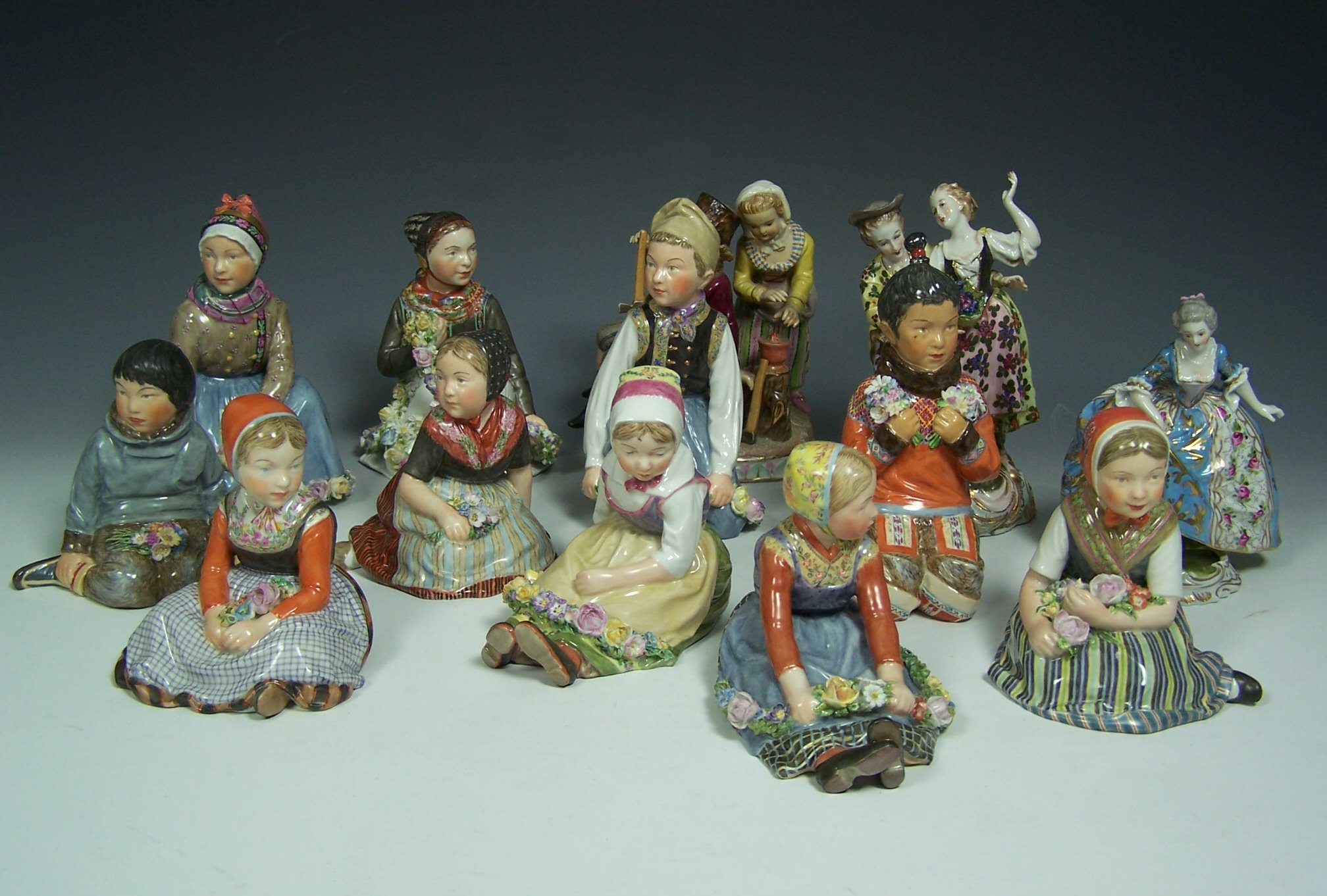 A set of ten Royal Copenhagen porcelain figures of children