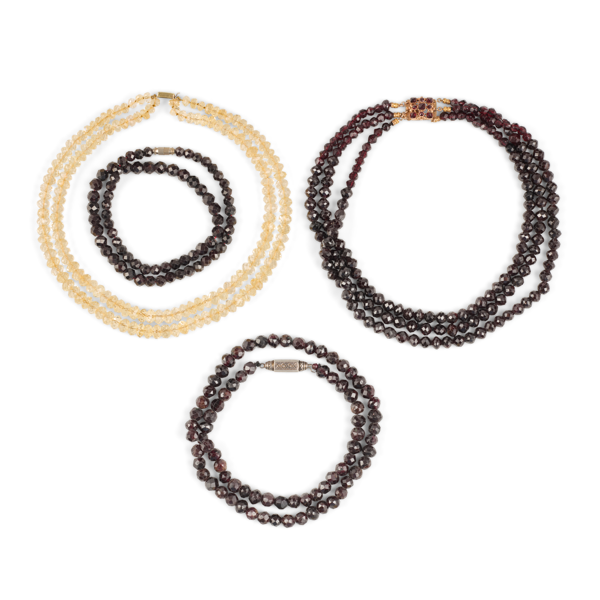 A collection of four beaded necklaces
