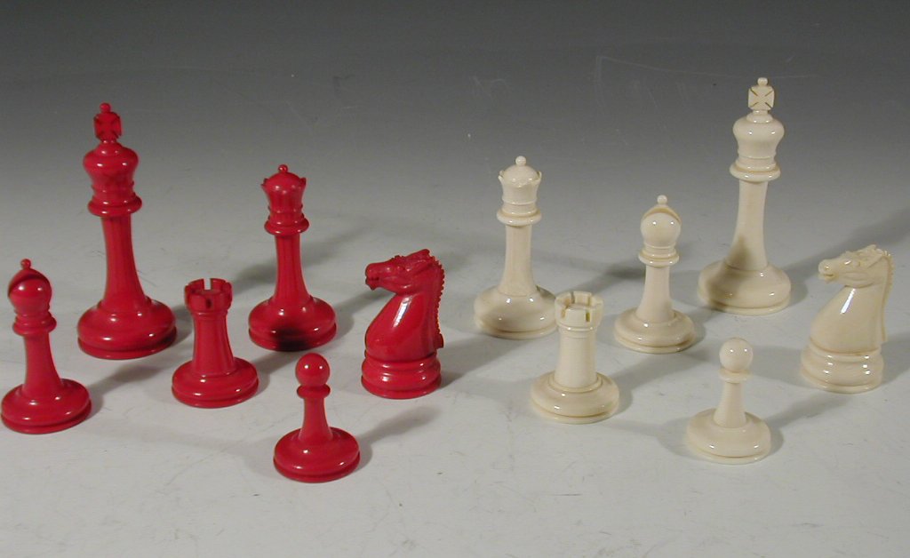 A 20th century NOTE DATE ivory and stained ivory chess set