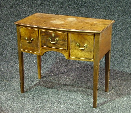 A mahogany bowfront kneehole dressing table,