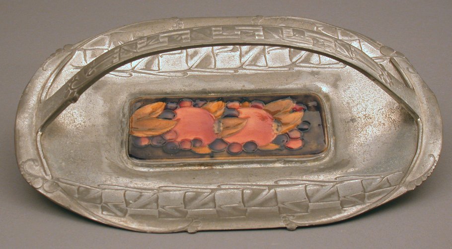A Tudric pewter cake tray