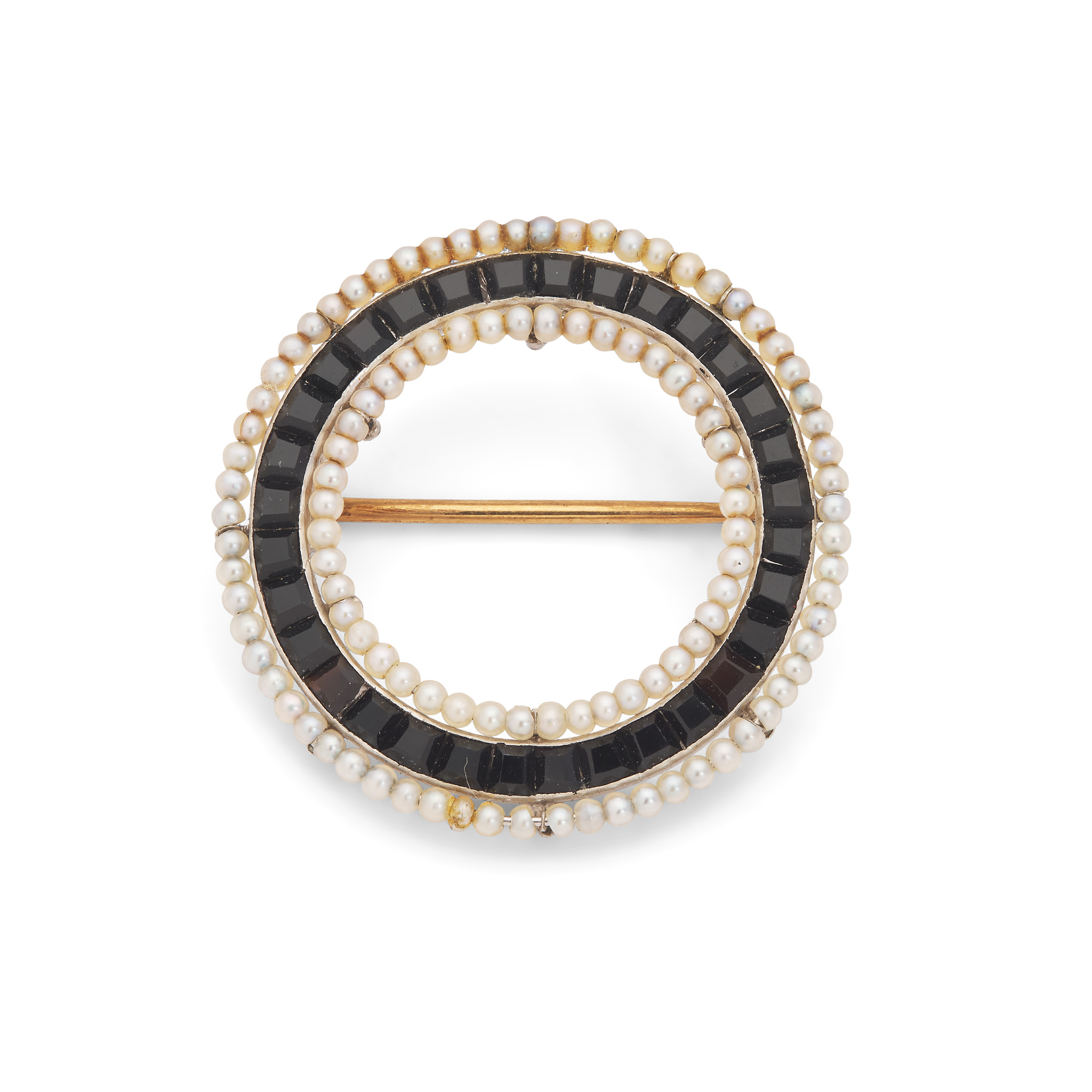 A 1920s onyx and seed pearl brooch
