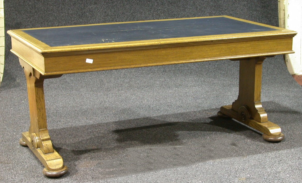 A pair of oak library tables,