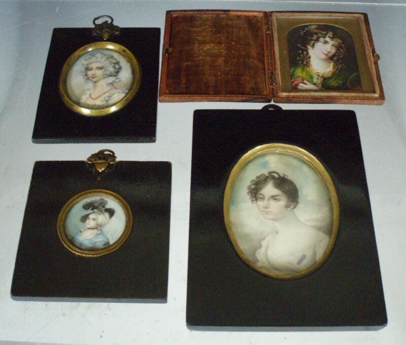 A group of four 19th century portrait miniatures of ladies