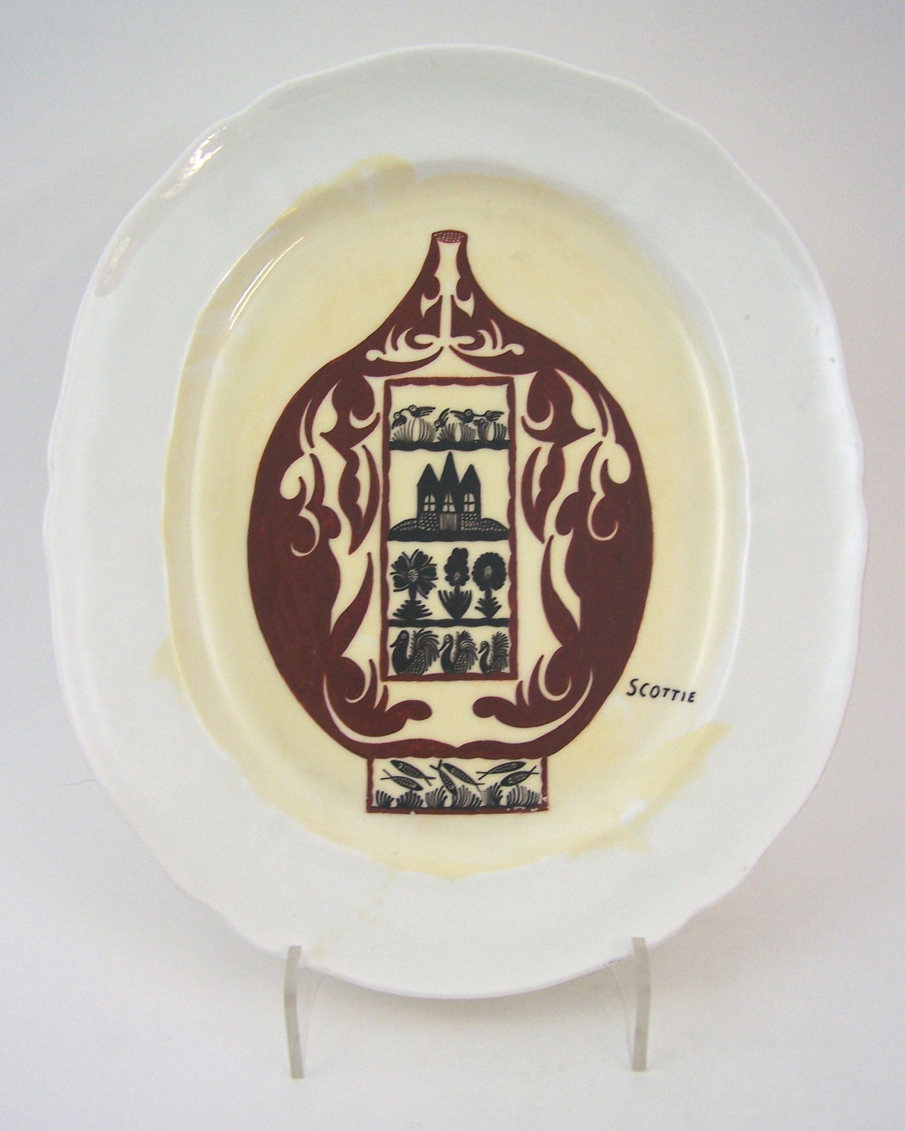 Scottie Wilson (1891-1972) An oval hand-painted ashet,