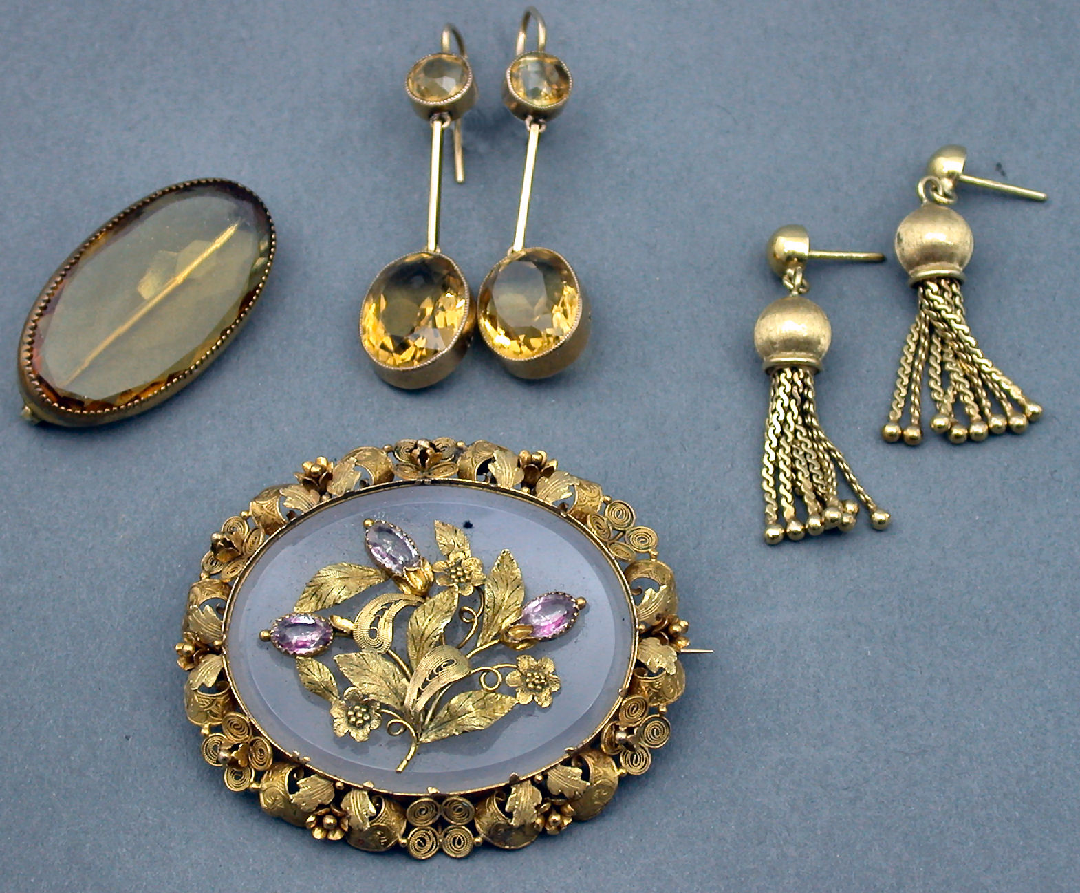 A pair of 9ct gold mounted citrine pendant earrings,