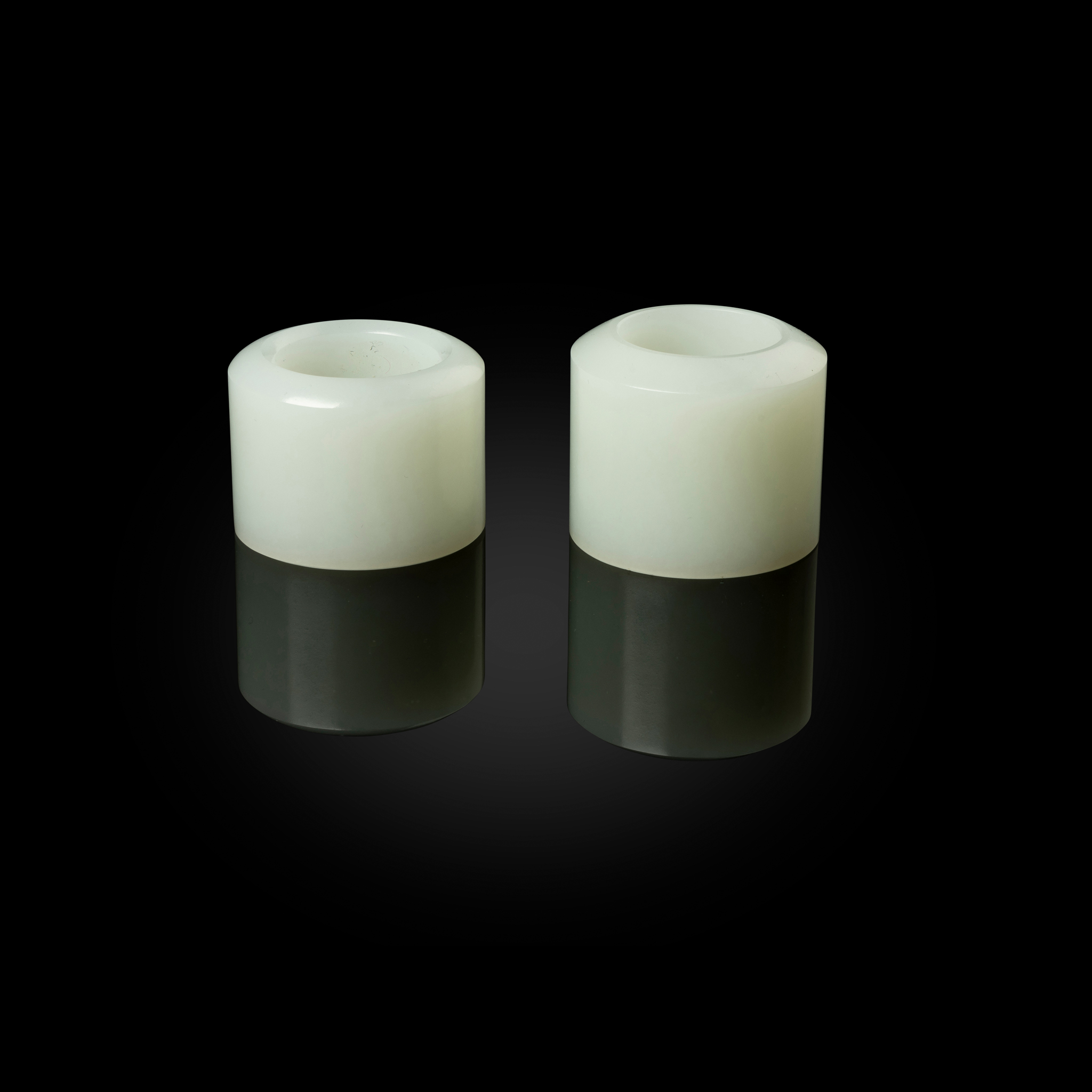 TWO CHINESE WHITE JADE THUMB RINGS