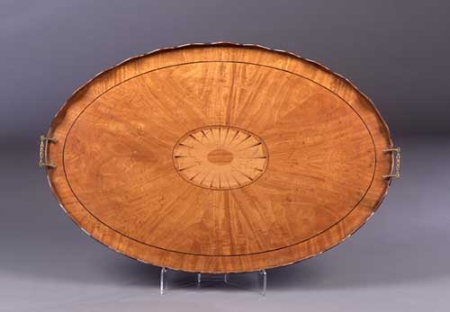 An Edwardian oval satinwood tray