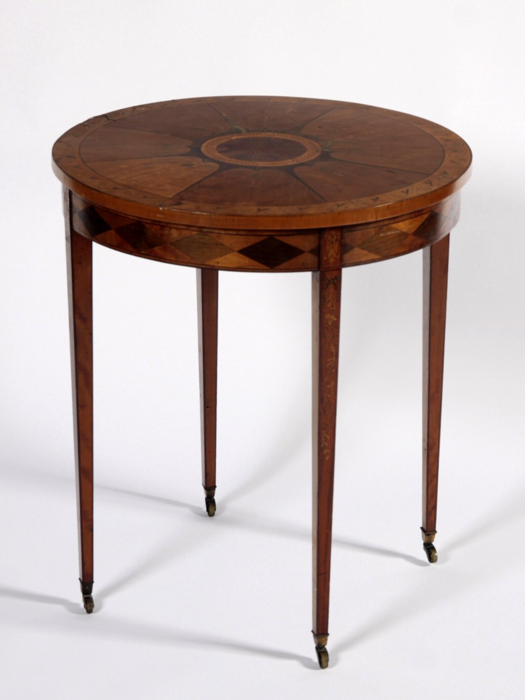 A 19th century Sheraton style satinwood inlaid occasional table
