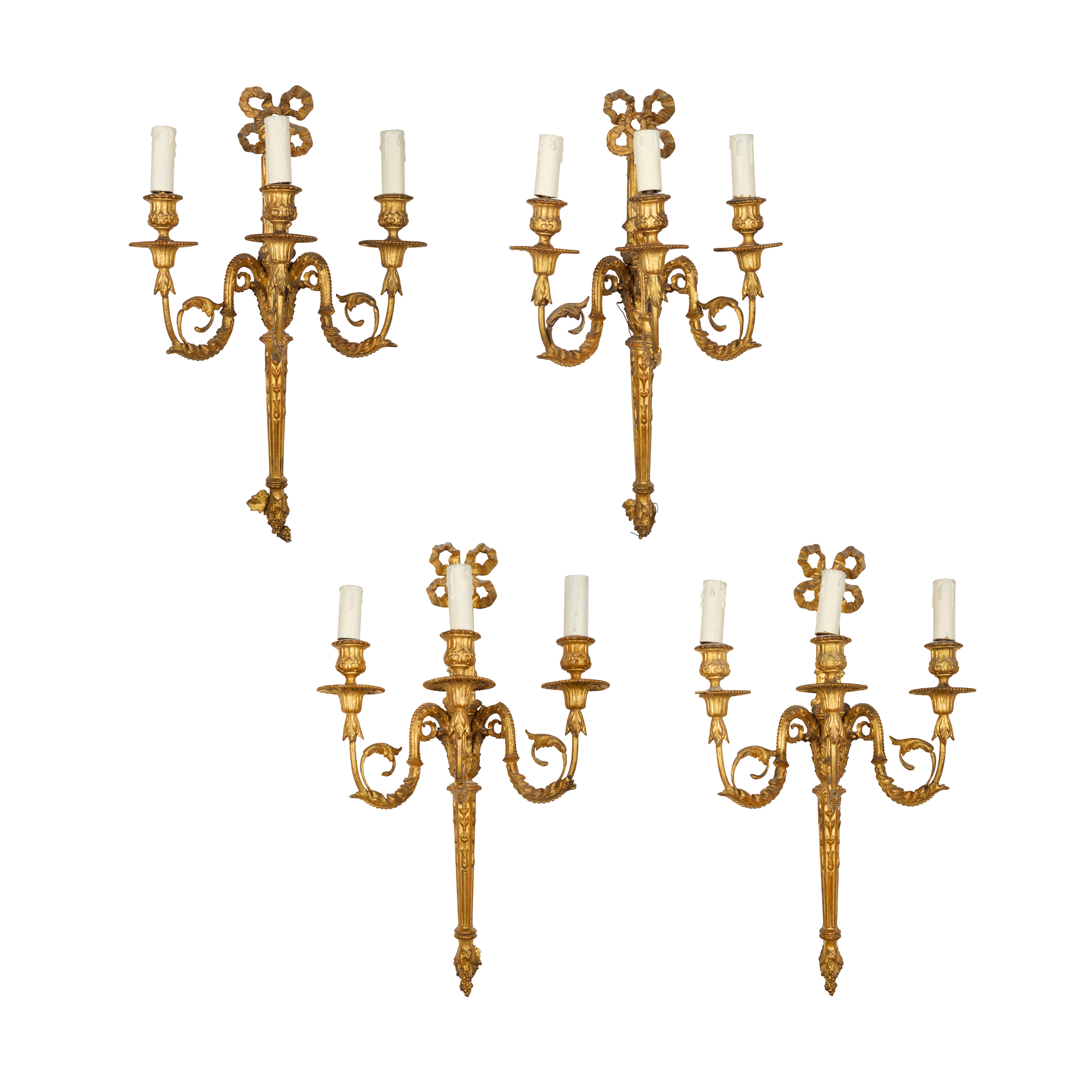 SET OF FOUR NEOCLASSICAL STYLE THREE LIGHT GILTWOOD AND GESSO SCONCES