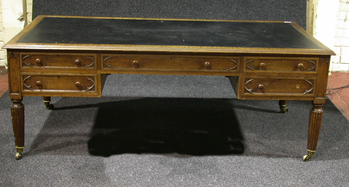 A Victorian Gothic oak partners desk,