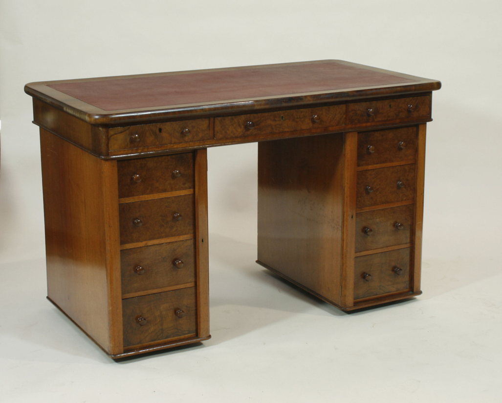 A Victorian burr walnut twin pedestal desk