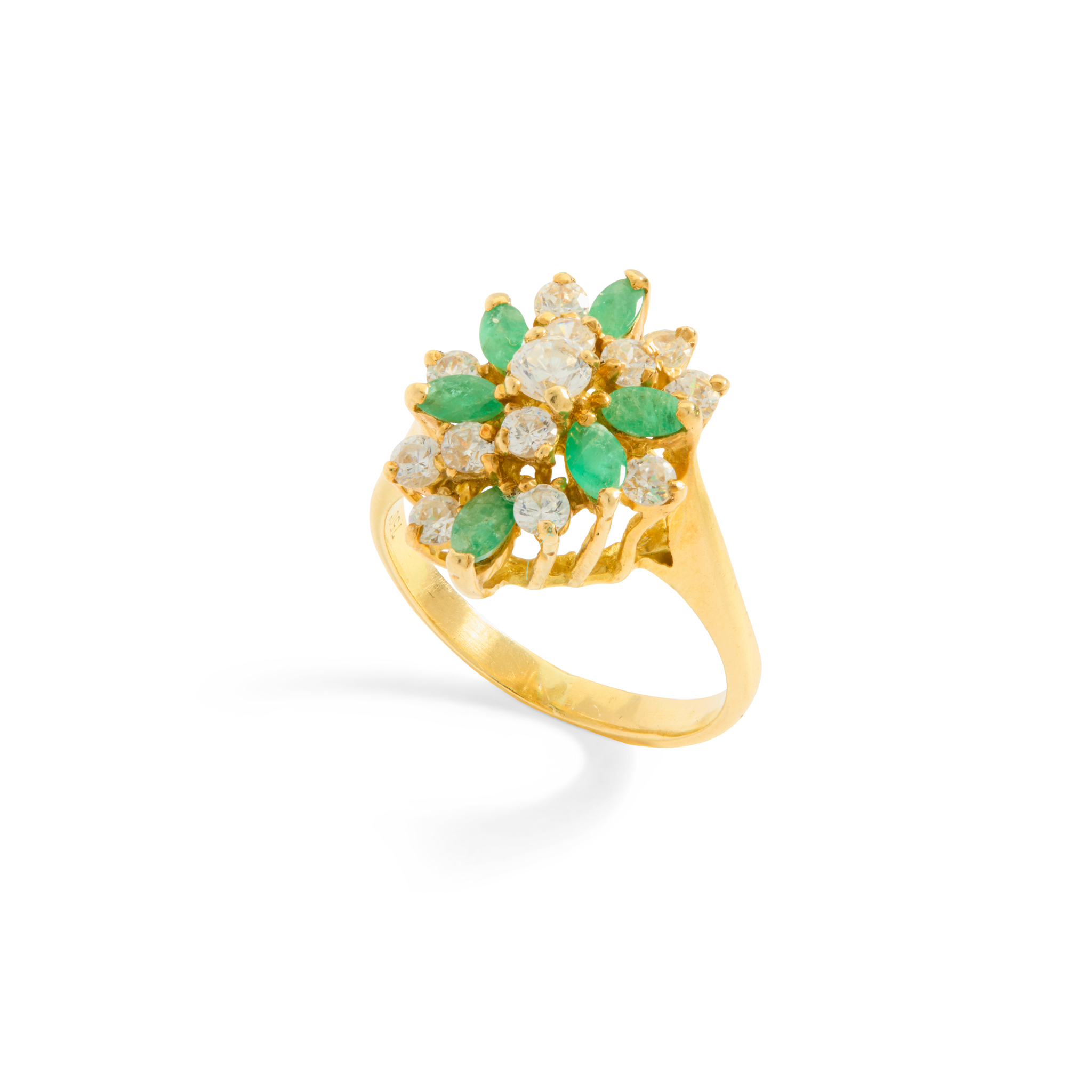 An emerald and white stone cluster ring