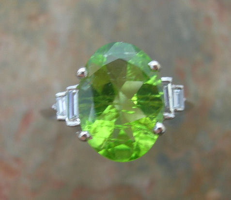 A peridot and diamond ring,