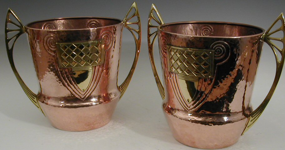 A pair of WMF copper and brass jardinieres,