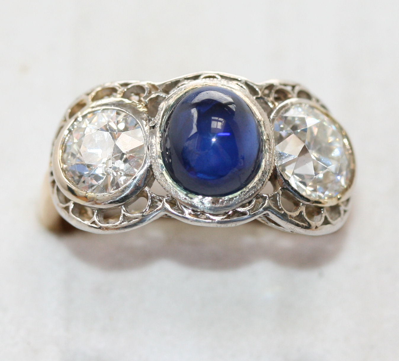 An early 20th century sapphire and diamond set three-stone ring,