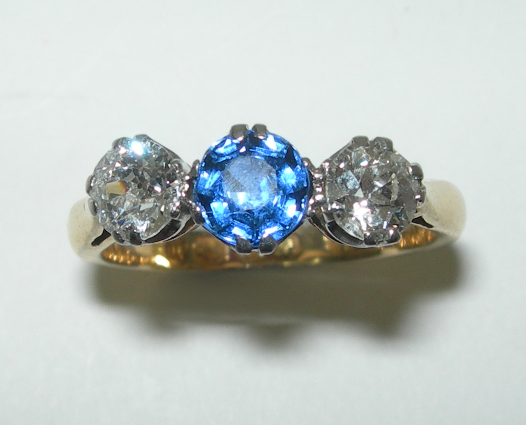 A late Victorian three-stone ring,