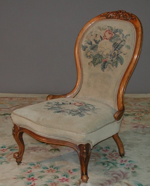 A Victorian mahogany framed spoon back open armchair
