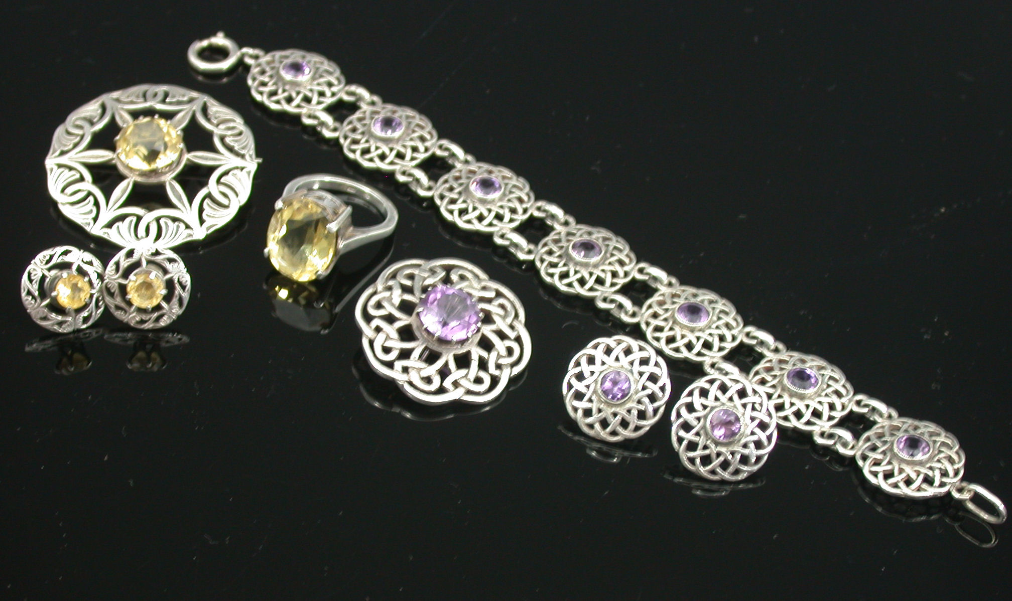 A pierced shaped circular brooch by John Hart,