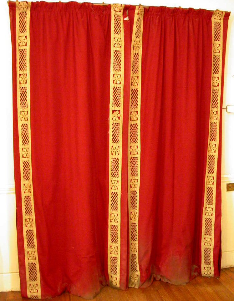 Two pairs of red velvet curtains