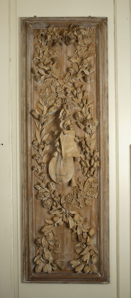 A pair of large carved pine rectangular wall panels