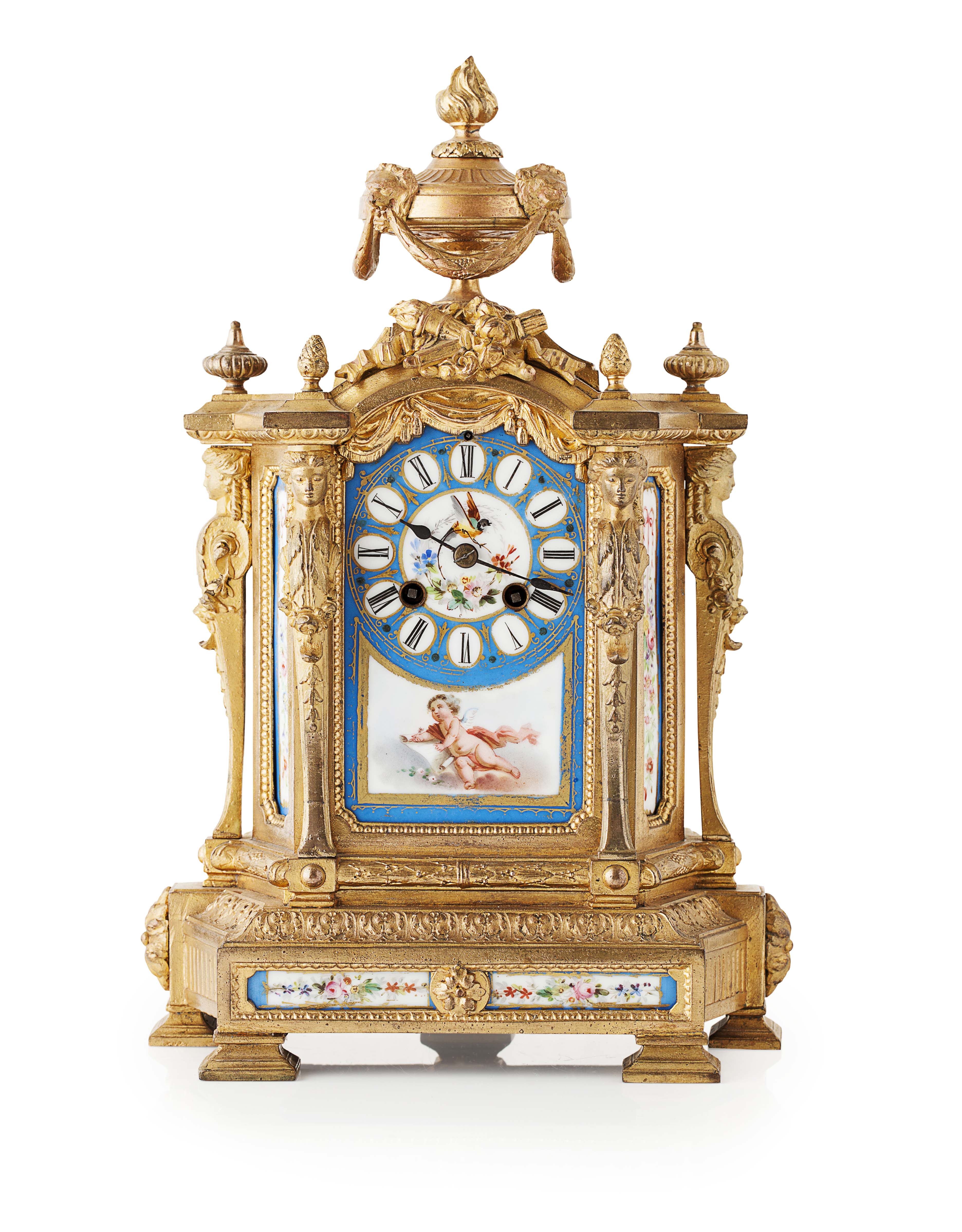 FRENCH GILTMETAL AND PORCELAIN MOUNTED MANTEL CLOCK