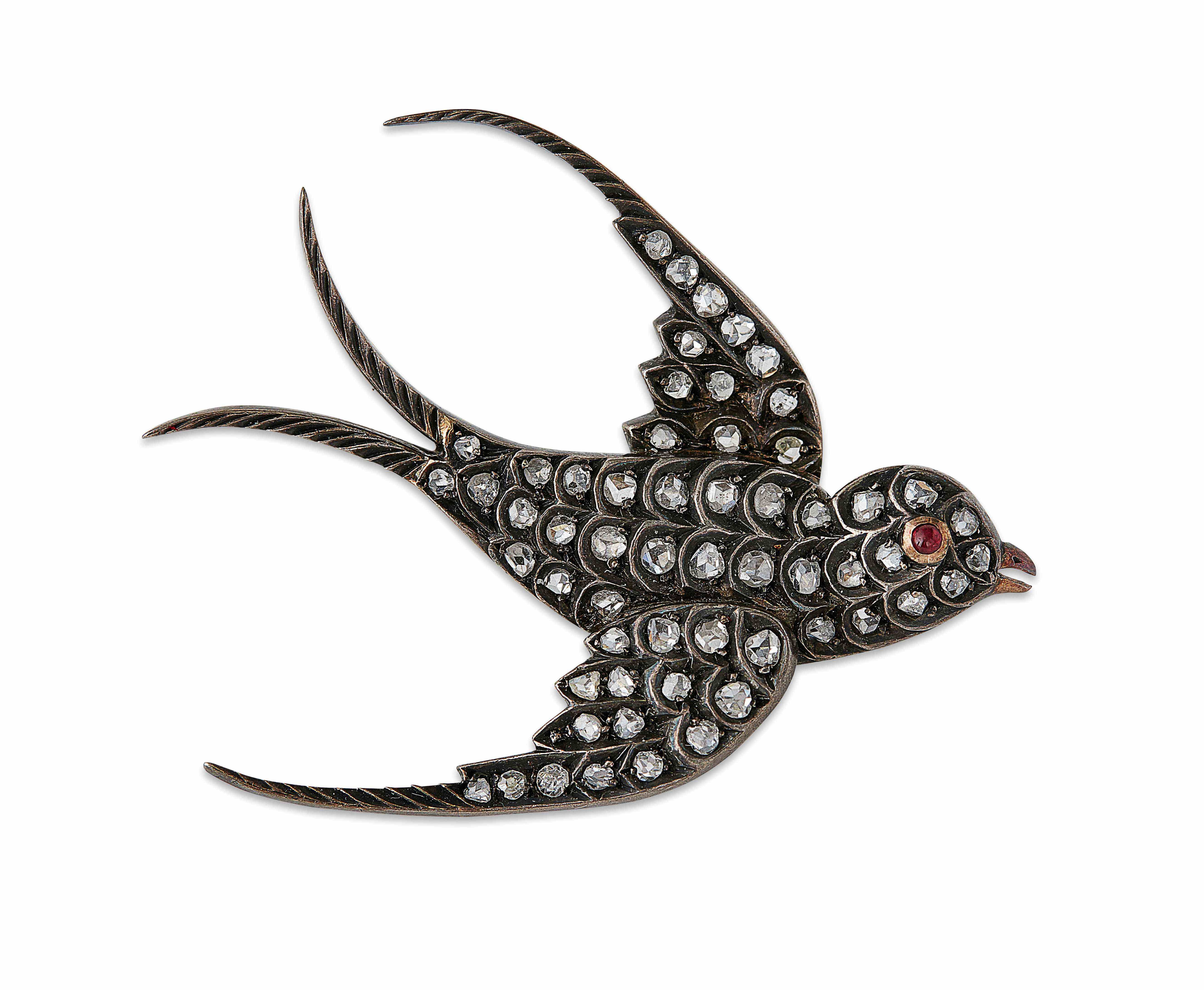 A diamond set swallow brooch