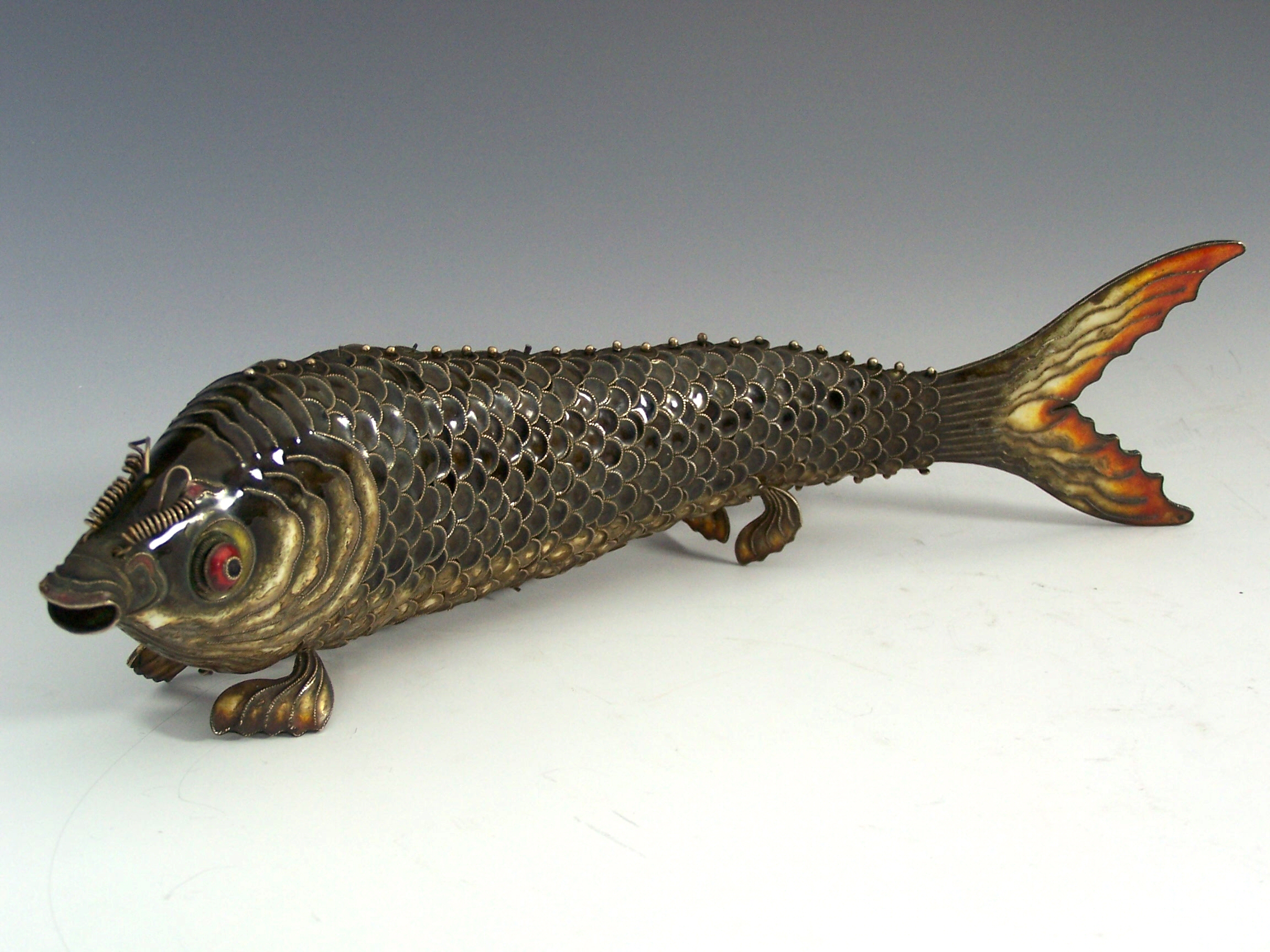 A Japanese articulated white metal and enamel fish, 20th century,
