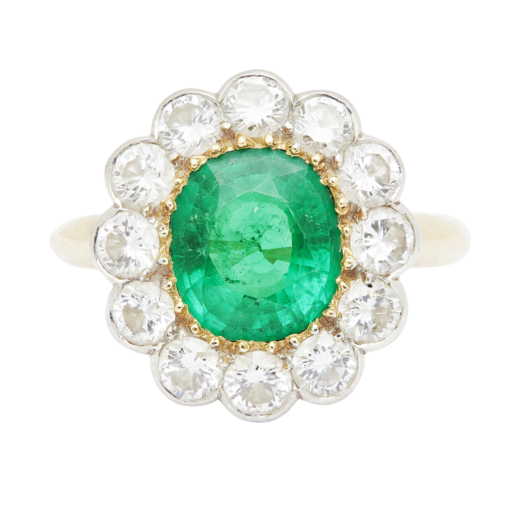 An emerald and diamond set ring