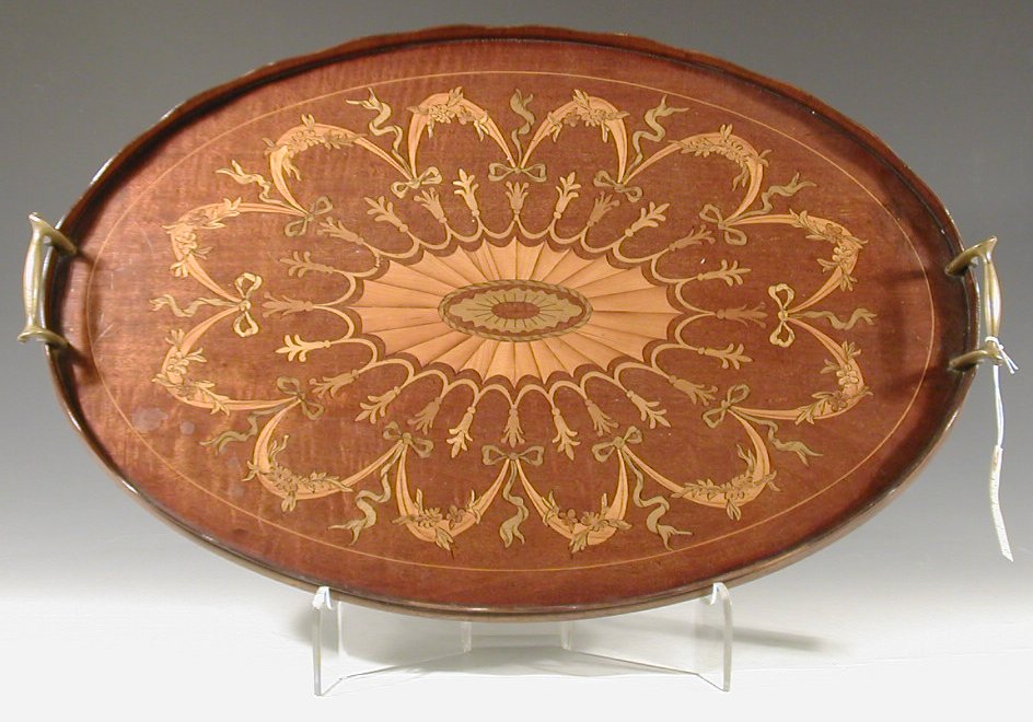 An Edwardian oval mahogany tea tray
