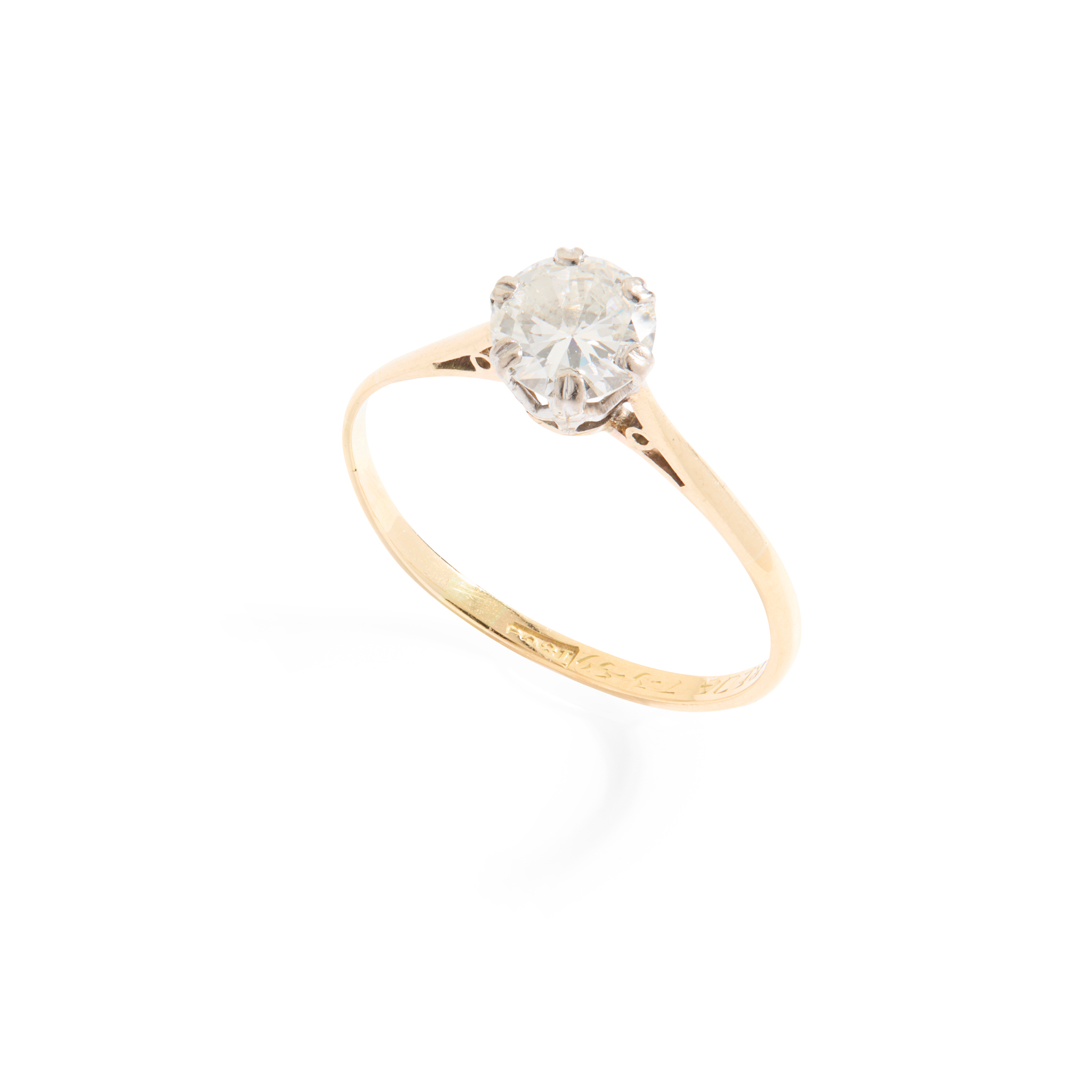 A diamond single-stone ring in 18ct yellow gold