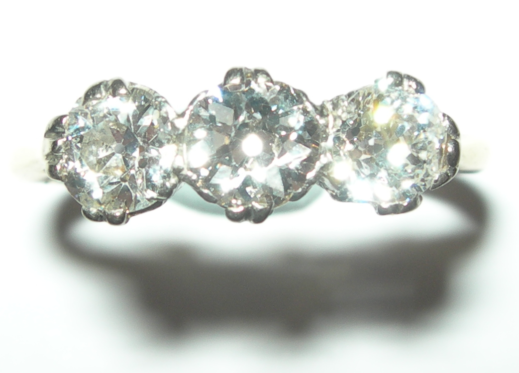 An 18ct gold mounted three-stone diamond ring,