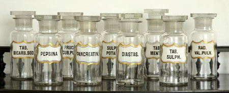 A set of nine small apothecary’s glass bottles