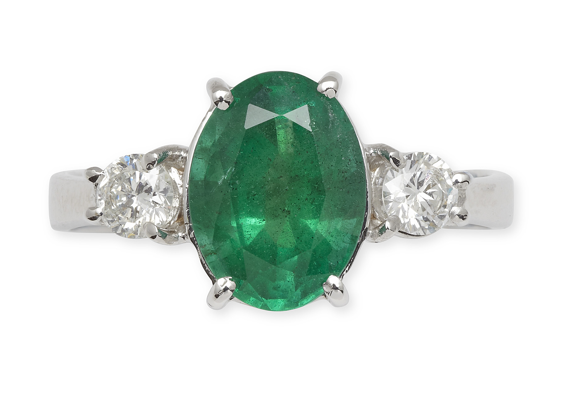 An 18ct white gold mounted emerald and diamond three-stone ring
