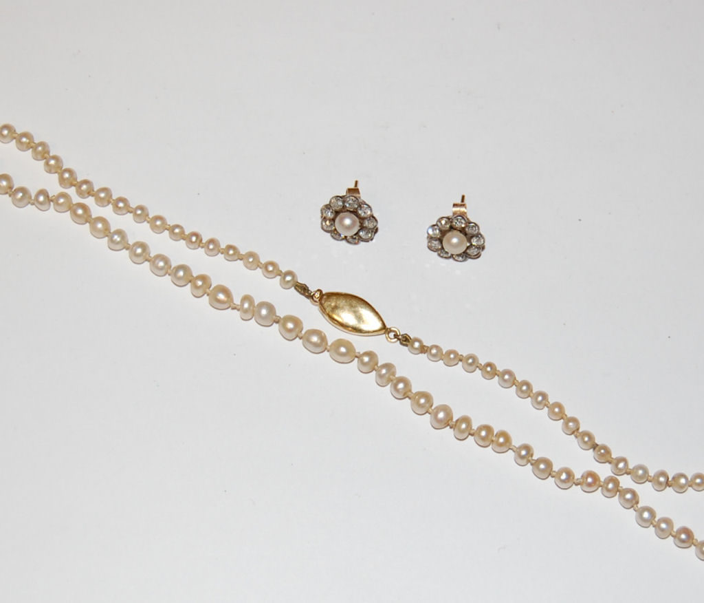 A pair of Edwardian pearl and diamond floral cluster earrings