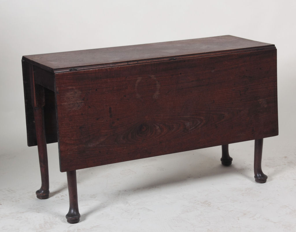 A George II mahogany drop flap dining table