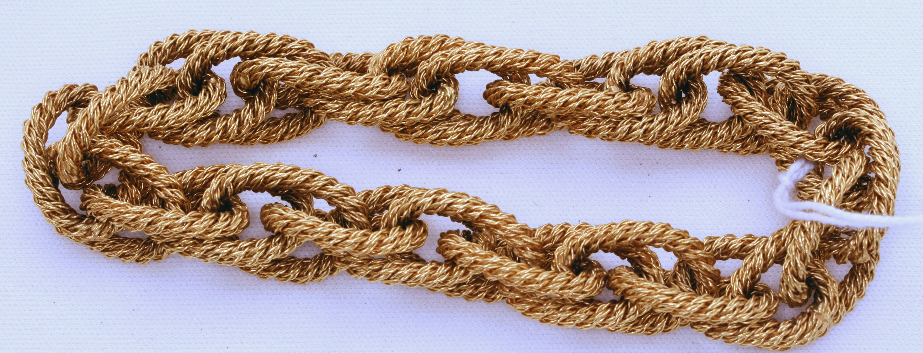 A yellow metal bracelet