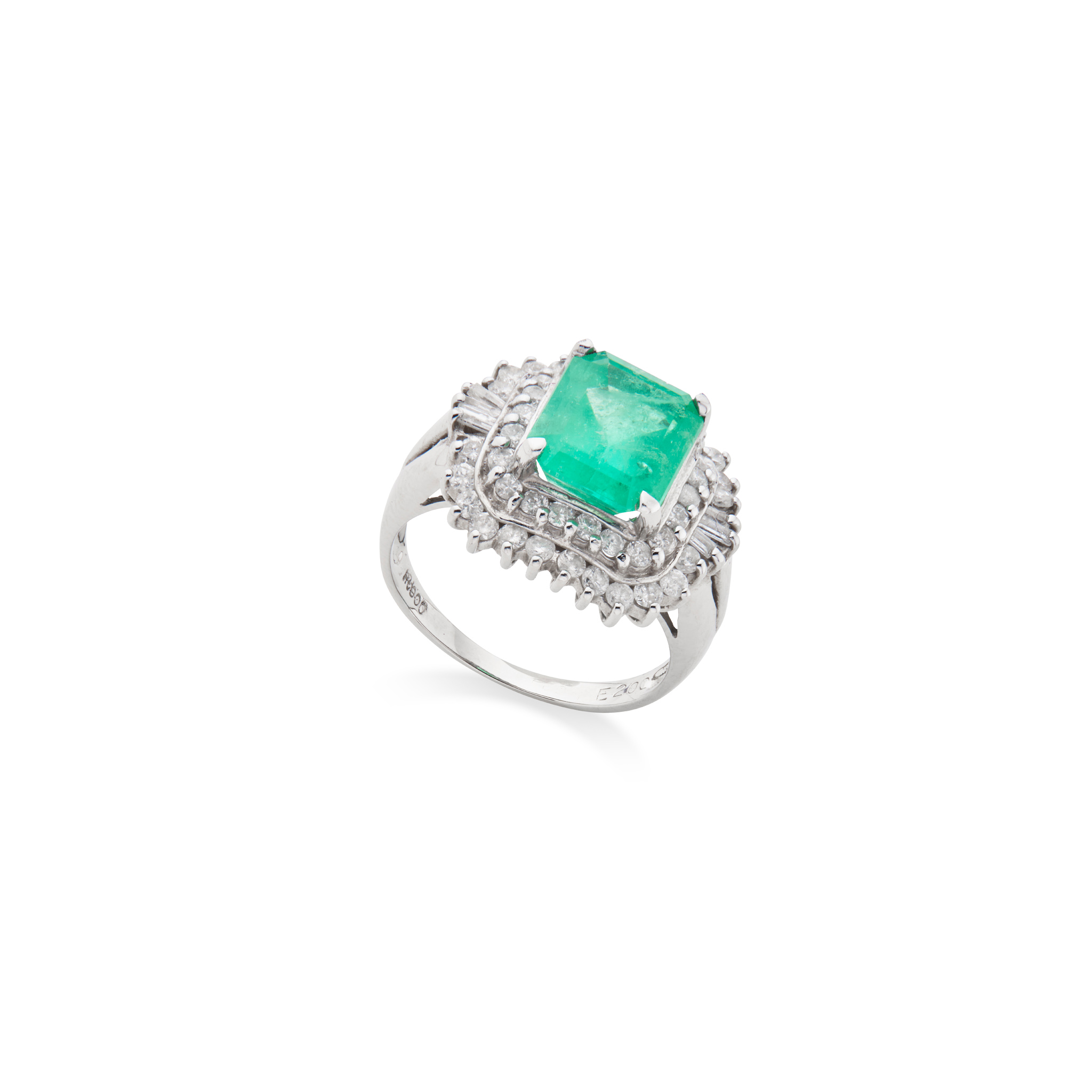 An emerald and diamond cluster ring