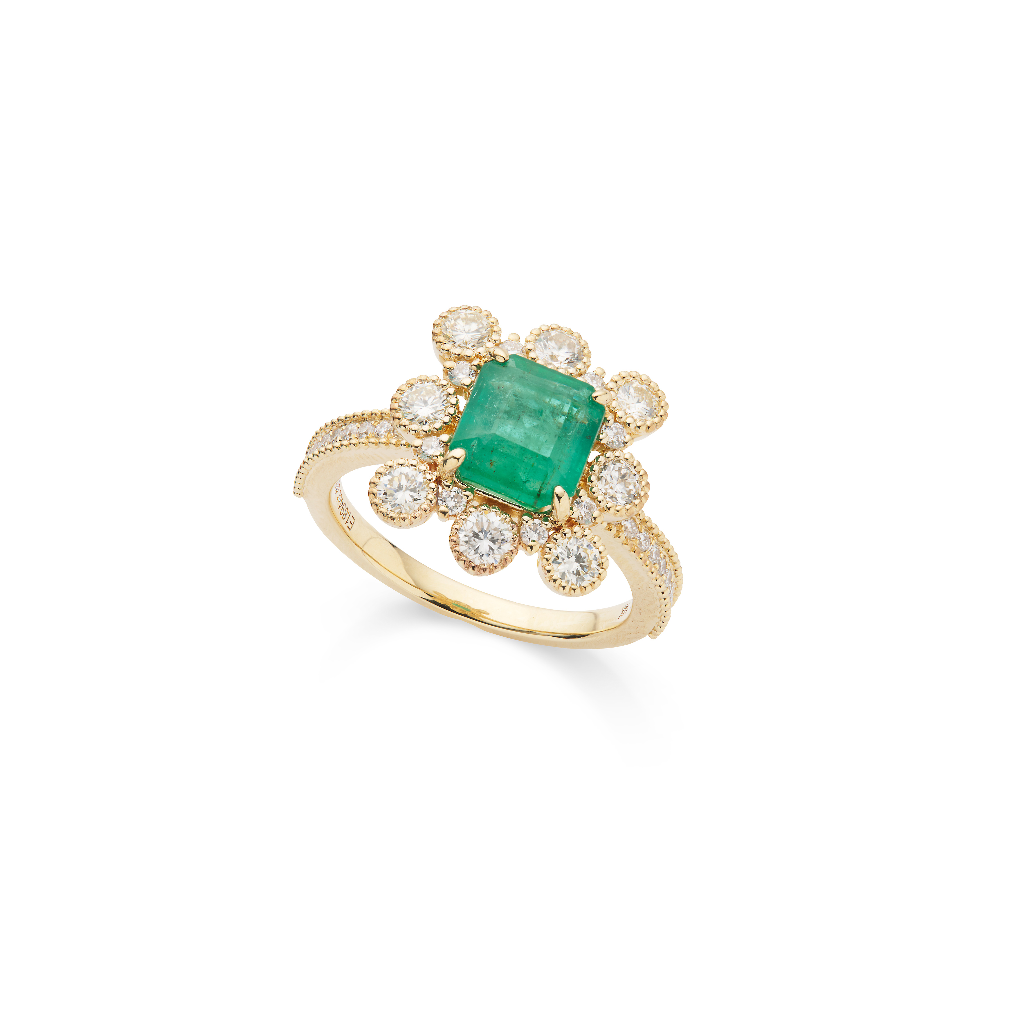 An emerald and diamond cluster ring