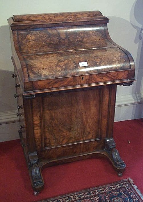 A Victorian walnut davenport,