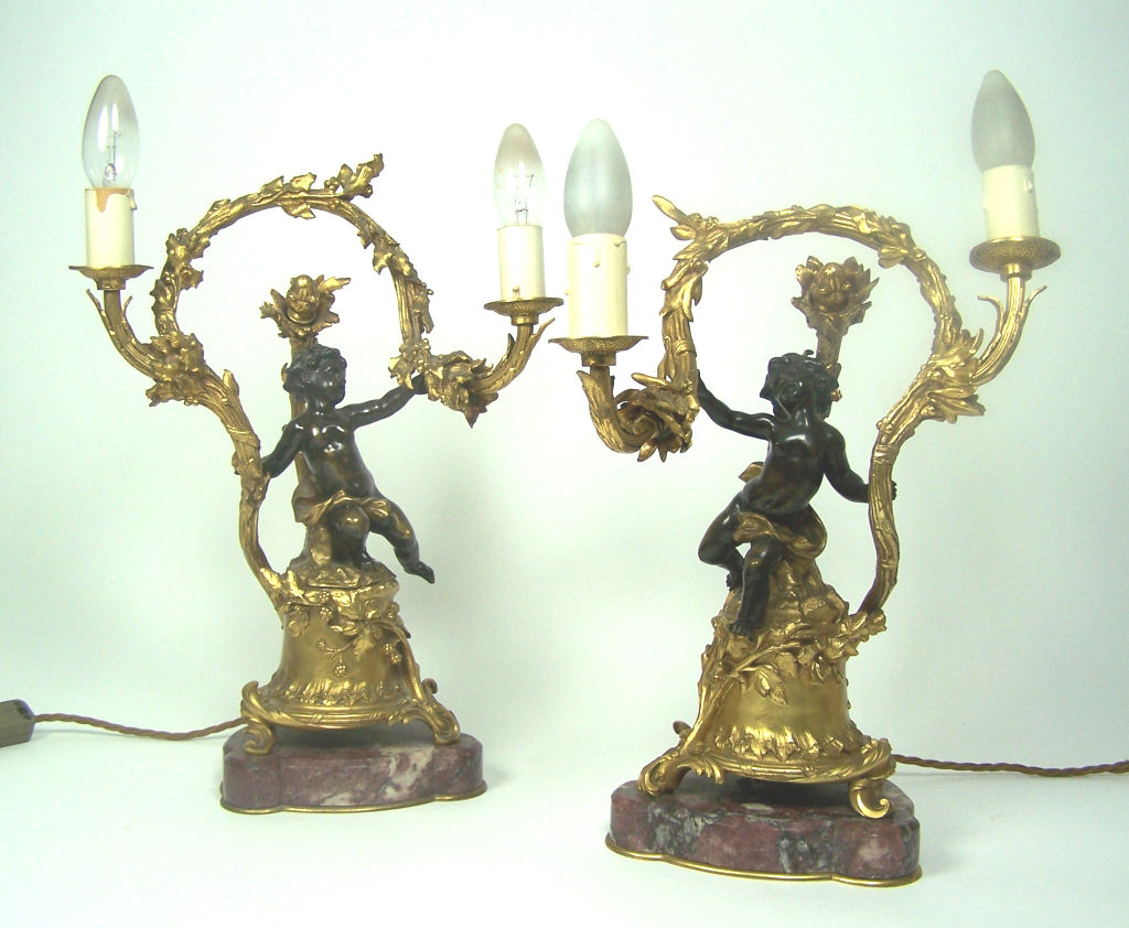 A pair of 19th century bronze and ormolu candelabra In the Louis XV style