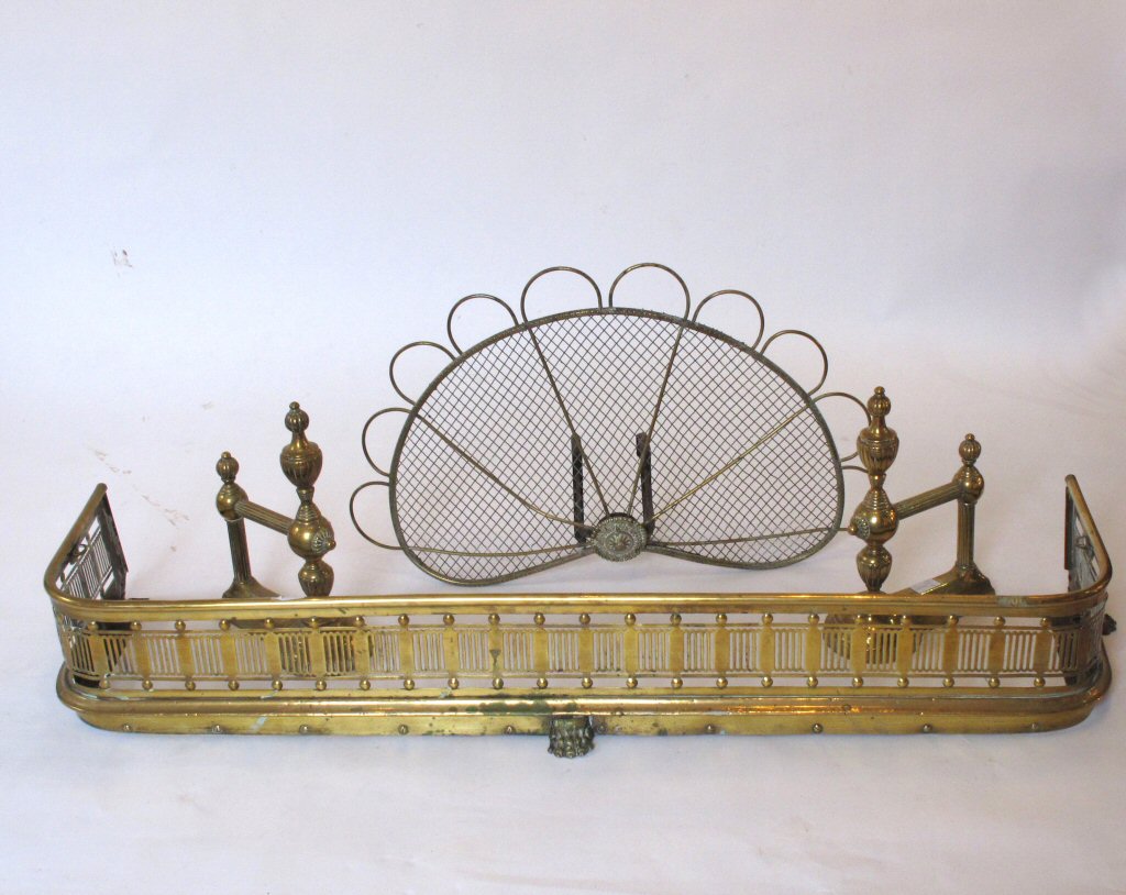 A group of brass fire furniture