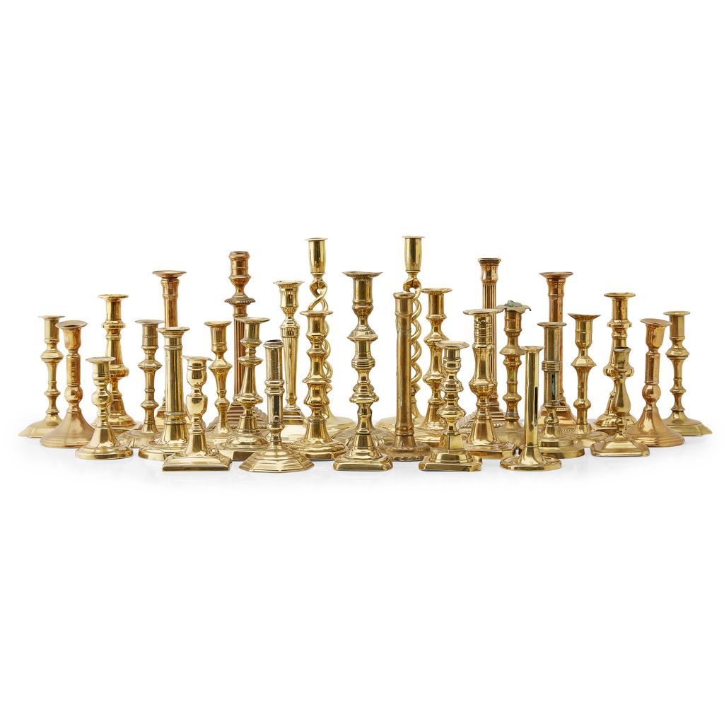 LARGE GROUP OF GEORGIAN AND REGENCY BRASS CANDLESTICKS