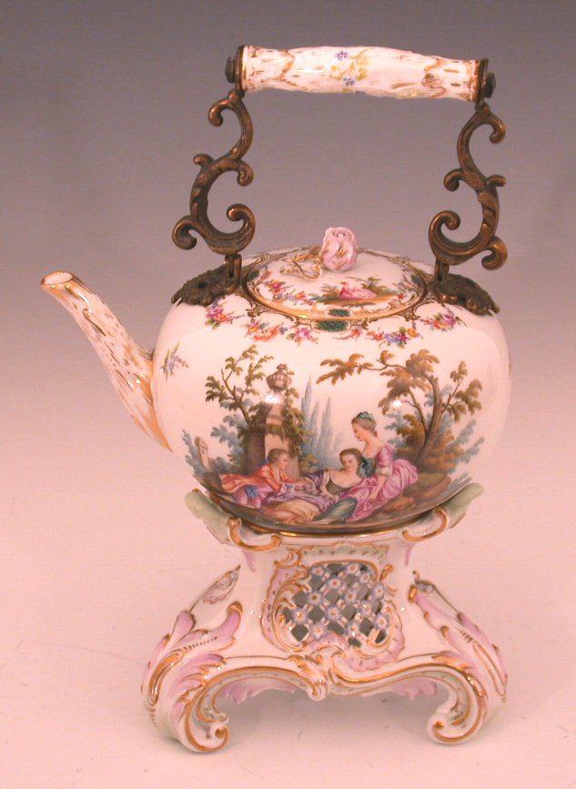 A late 19th century Dresden kettle on matched stand,