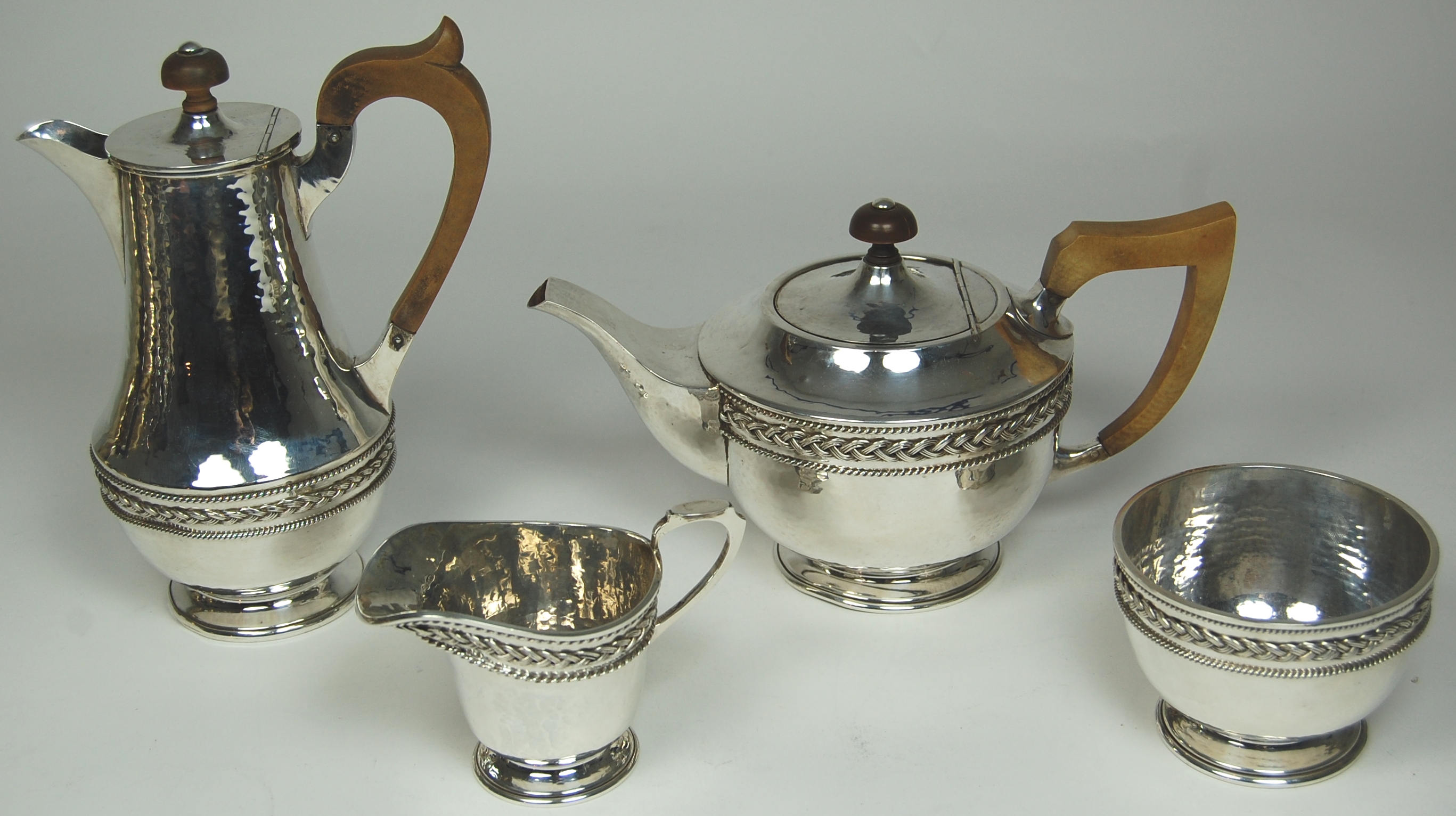 An Arts & Crafts style four piece tea set