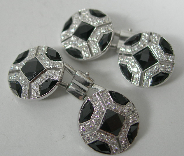 A pair of onyx and diamond cufflinks,